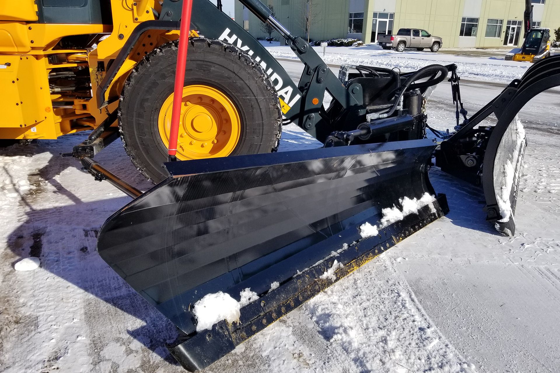 HL940TM Wheel Loader With Burke-Yes Equipment Wing & Snow Plow Close UP